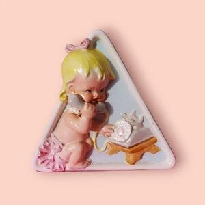 Vintage baby planter. Baby girl on phone